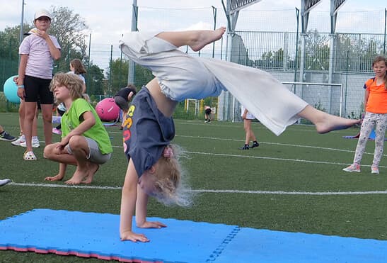 Children in athletic wear doing gymnastics at Studio 33